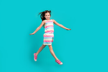 Fototapeta na wymiar Full length photo of adorable positive girl wear stylish clothes have fun go store summer seasonal offer isolated on blue color background