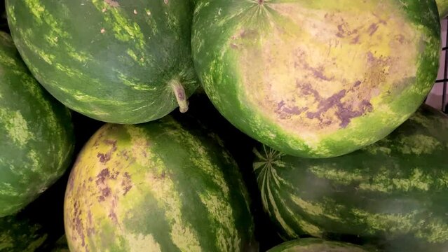 A lot of watermelons in the supermarket, top view