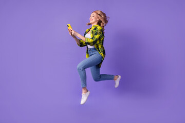 Full body photo of funny blogging jump woman run with samsung iphone record video instagram...