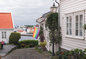 colorful rainbow flag in the white house on the street of the old town of Stavanger, Norway