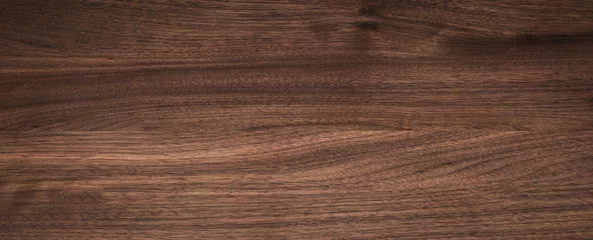 Foto op Aluminium Walnut wood texture background. Wide format black walnut natural texture desktop background.  © suey