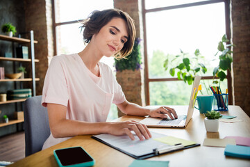 Photo of young woman brown bob hair first job dealer prepare contract for sale products browsing laptop isolated new office background