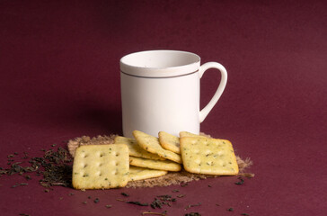 Crunchy  biscuit for healthy life with wheat and cup of tea for breakfast.