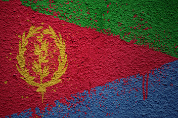 painted big national flag of eritrea on a massive old cracked wall