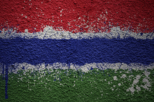 painted big national flag of gambia on a massive old cracked wall