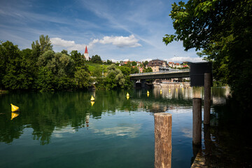 Yellow floating buoy on a river in Europe. Sunny summer day, no people