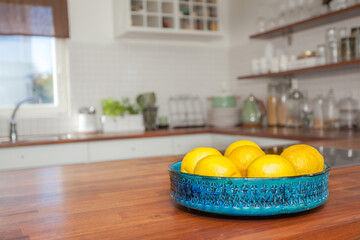 lemons in bowl on the kitchen countertop