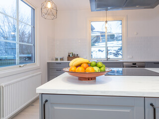 fruit bowl on kitchen counter grey cabinetts 