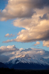Portrait of an incredible sunset against a huge snowy mountain.