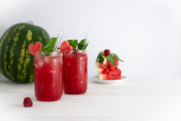 Watermelon lemonade with mint and watermelon on a white background