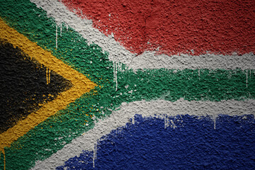 painted big national flag of south africa on a massive old cracked wall