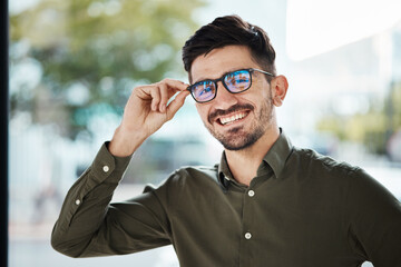 Portrait, face of man and happy with glasses for vision, eyesight and prescription lens. Young male person smile with new frame for designer eyewear, optical fashion and assessment in eye care clinic