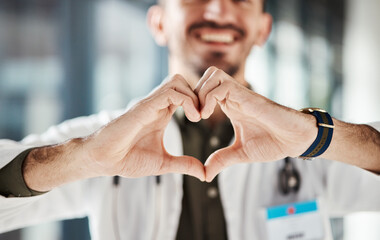 Hospital doctor, happy man and closeup heart hands for surgeon healthcare, medical services and...