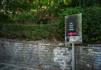GJIROKASTER, ALBANIA, SEPTEMBER 2022: sign showing direction to the COLD WAR TUNNEL in Gjirokaster Citadel surrounded by ancient ruins, attraction in Albania, Europe