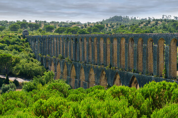 the aqueduct was built by Filipe Terzio, and completed by Pedro Fernando de Torres in 1614 the aqueduct supplied the convent of christ in Tomar portugal with its water. 
