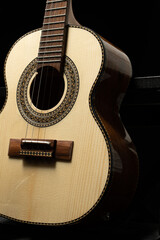 acoustic guitar on black background