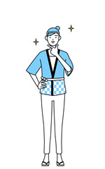 自信家のポーズを取る夏祭りの法被を着た女性