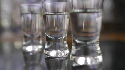 Pouring Vodka into Shot-Glasses Slow Motion