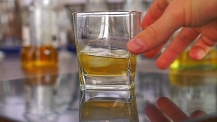 Drinking Whiskey with Ice Cubes from Drink Glass Slow Motion