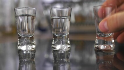 Drinking Vodka from Shot-Glasses Close-Up