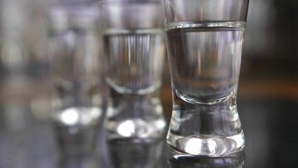 Pouring Vodka into Shot-Glasses Slow Motion