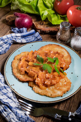 Homemade potato pancakes with goulash.