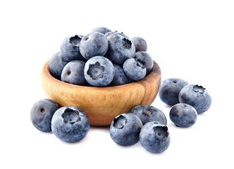 Blueberries Isolated on White Background. Ripe berries closeup in wooden bowl.