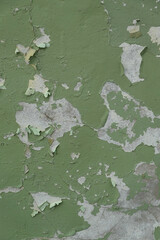 Peinture verte écaillée sur un mur