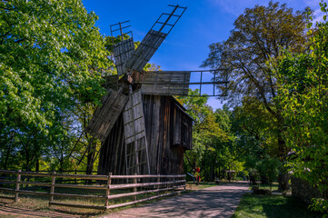 Fototapeta na wymiar BUCHAREST, ROMANIA: 19th Century Old Windmill In Dimitrie Gusti National Village Museum (Muzeul Satului).