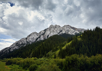 Fototapeta na wymiar Mountain valley and green rocky hill in Kazakhstan
