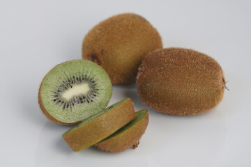 Close up of sliced kiwi fruit. Kiwi isolated on white background, stacked with clipping path. Kiwi have juice rich in vitamins and energy. Fresh fruits concept.