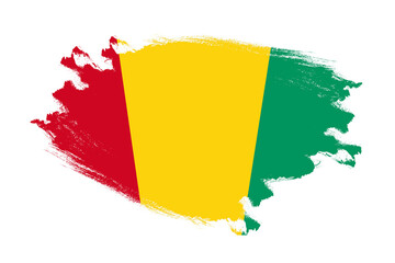 Abstract stroke brush textured national flag of Guinea on isolated white background