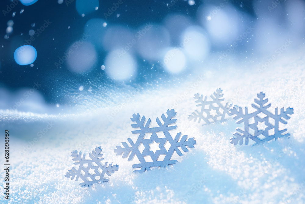 Poster beautiful decorative snowflakes in the snow against a blue natural background with falling snow and 
