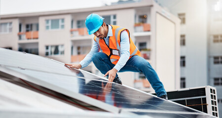 Technician man, construction and solar panel on roof for maintenance, sustainability or inspection...