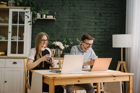 Coffee break. Two happy successful excited traders investors. Success stock exchange trading deal, rising crypto bull market shares, growth bitcoin stock, ipo profit victory concept. Works on a laptop - Powered by Adobe