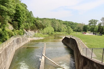 The flowing water from the dam into the creek.