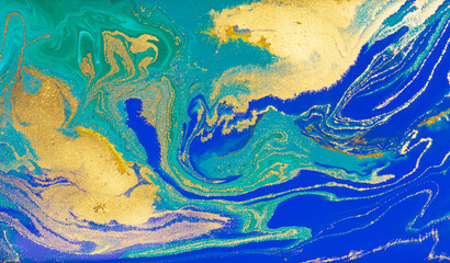 Fototapeta na wymiar Blue and Golden Dust Placer on Liquid Blue Ink Background.