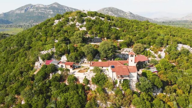 Monastery Kom in Skadar lake. Serbian Orthodox monastery in Montenegro. Religious and tourist attraction of Montenegro.