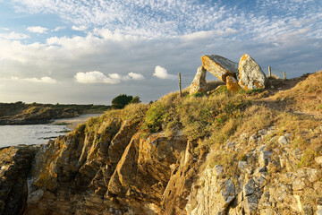 Coastal erosion degrades the prehistoric Dolmen du Crapaud megalithic burial chamber near Billiers,...