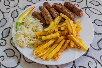Meal in North Macedonia - cevapi with fries.