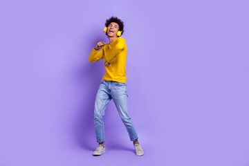 Fototapeta na wymiar Full body photo of young guy dancing boogie woogie carefree chill party rest relax discotheque meloman isolated on violet color background