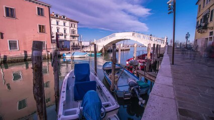 Timelapse of the bridge on the canal with boats