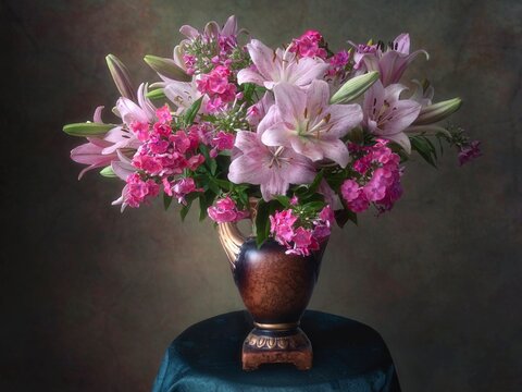 Still life with a bouquet of pink lilies and phlox
