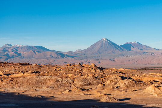 Volcanic snowy peak viewed from Vallecito in Atacama desert