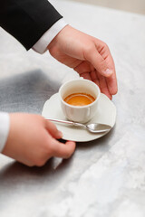Top shot for professional serving a cup of coffee