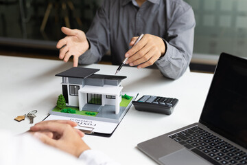 Real estate agents negotiate for businessmen to legally sign home purchase agreements contract , rent, mortgage, lease.