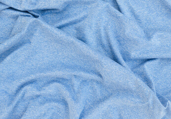 Wrinkled blue fabric background.
Fabric for fashion concept.