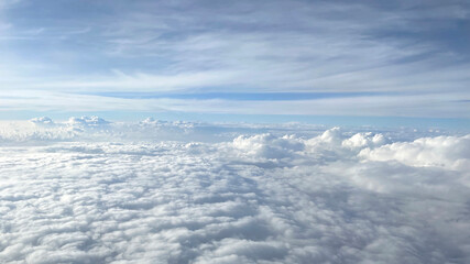 Clouds against the blue sky from the airplane window