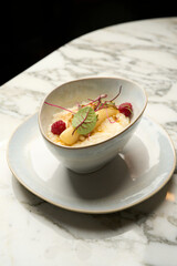 Healthy breakfast rice porridge with banana and raspberry