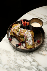Sliced bread toast with milk cream and fresh berries